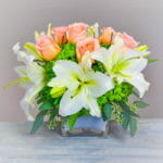 Pink roses white lilies green hydrangea floral centerpiece - About Us