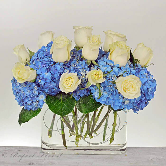 blue hydrangea and white rose boutonniere