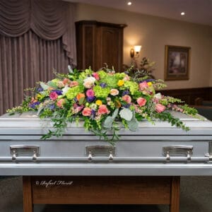 green puple pink casket floral - Peaceful Casket Spray - CS6