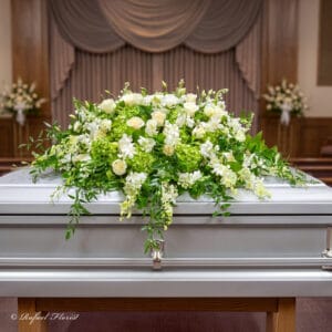 green and white funeral casket flowers - Whispers of Love Casket Spray - CS19